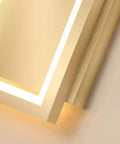Close-up of Super Tight 16W Gold LED Wall Sconce With Dimmable Rectangle Frame showing illuminated edges and sleek design.