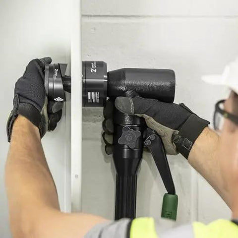 Using Heavy Duty Hydraulic Knockout Kit With Quick Draw Driver For 0.5 To 2 Inch Holes on metal panel