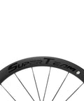 Close-up of Tubeless 45mm Carbon Road Wheelset With 700c Rims And 25mm Tires Disc Brake Compatible Carbon Fiber Toray T700 Spokes UD Matte Finish.