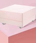 24 Pcs Self Adhesive Caster Wheels Set For Boxes And Storage Racks Ideal For DIY Projects And Heavy Load Bins, shown on pink box