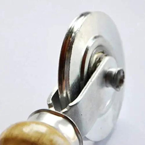 Close-up of the Pro Grade Manual Double Head Screen Window Roller with solid wooden handle and shiny metal wheel for vinyl installs.