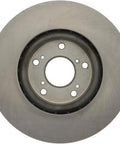 Front brake rotor with central hub and six lug holes; metallic gray steel disc.