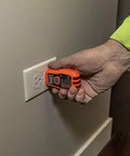 Person using GFCI tester from All In One Electrical Tester Kit With Circuit Breaker Finder GFCI Receptacle Tester Multimeter NCVT.