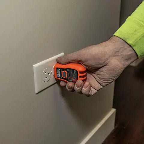Person using GFCI tester from All In One Electrical Tester Kit With Circuit Breaker Finder GFCI Receptacle Tester Multimeter NCVT.