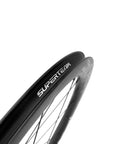 Close-up of 45mm carbon tubeless wheelset for disc brake road bikes with 25mm inner width showing the rim and spokes.