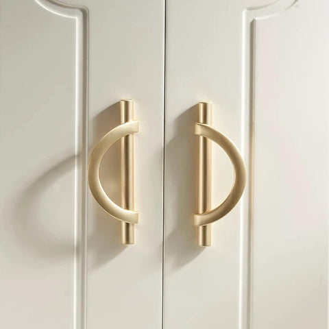 Brushed Gold Half Moon Cabinet Pulls installed on white cupboard doors, Set of 2, 3.75 Inch Length, Durably crafted from Zinc Alloy, Rust Resistant.
