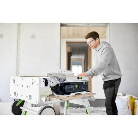 Cordless Table Saw With Battery Powered Circular Blade For Drop Dead Accurate Miter And Parallel Cuts Compact Portable Benchtop Tool in use on job site.
