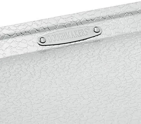 Close-up of the Pro Grade Aluminum Bake Pan 10 By 14 Inch Pebble Pattern for even browning and quick airflow.