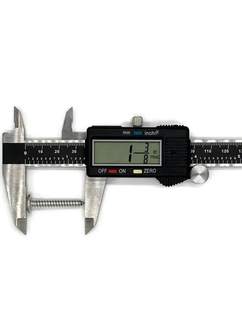 #10 x 1-1/4in stainless steel truss-head screw shown beside a digital caliper