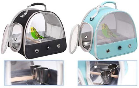 Two compact bird carriers with clear plastic domes, black and teal fabric, top handles.