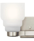 Close-up of glass detail on Fourteen And A Half Inch Two Light Vanity Light With Satin Etched Glass In Brushed Nickel.