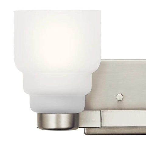 Close-up of glass detail on Fourteen And A Half Inch Two Light Vanity Light With Satin Etched Glass In Brushed Nickel.