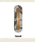 Modern Minimalist Long Marble Wall Sconce Nordic Alabaster Wall Mount Light Fixture showing text 'Turn off' with gold metal.