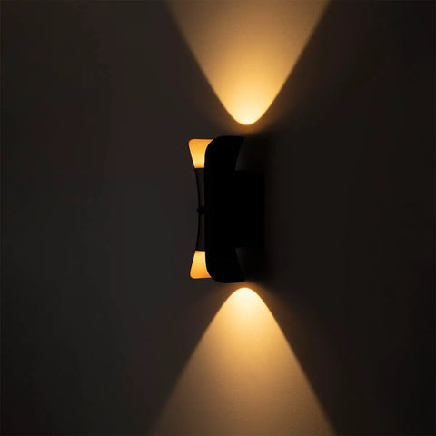 12 Inch Outdoor LED Wall Light with black finish and gold accent illuminating warm light, dusk to dawn sensor view