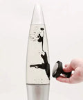 Hand using magnet on Retro Rocket Ship Ferrofluid Lava Lamp With Magnetic Black Wax In Clear Liquid, 15 Inch Tall, Silver Aluminum Base And Cap