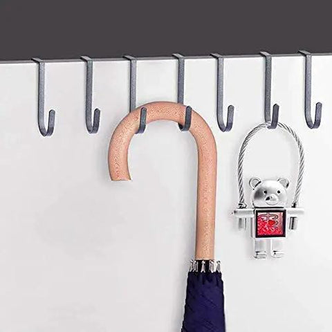 Rock Solid Stainless Steel Wall Mounted Coat Rack Featuring Smooth Polished S Shaped Hooks with umbrella and decorative keychain.