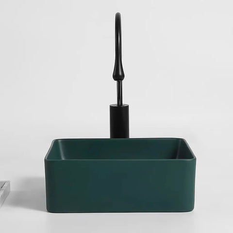 USZWBY Vessel Sinks Nordic Countertop Basin Matte Green Ceramic Square Washbasin with black faucet in a modern setting