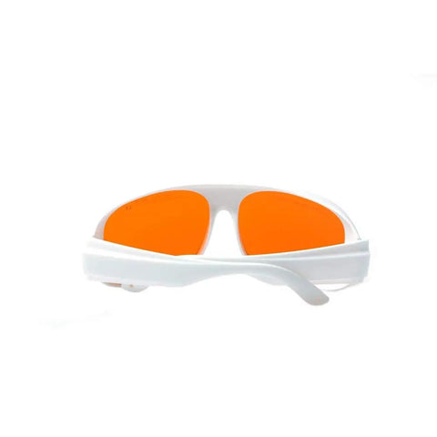 Top Shelf Heavy Duty Laser Safety Glasses Shielding Eyes From 532 Nanometer And 1064 Nanometer Beams With High Optical Density Rating For Lab And Workshop Use Straight Up Badass Eye Protection with white frame and orange lenses.