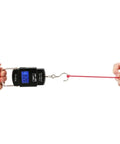 Digital hanging scale being used to weigh an object, showcasing easy grip handle and clear display for accurate readings.
