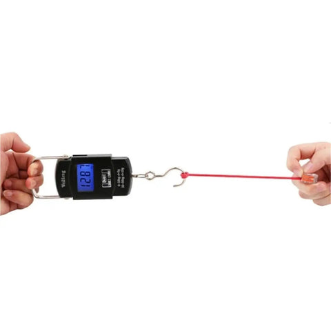 Digital hanging scale being used to weigh an object, showcasing easy grip handle and clear display for accurate readings.