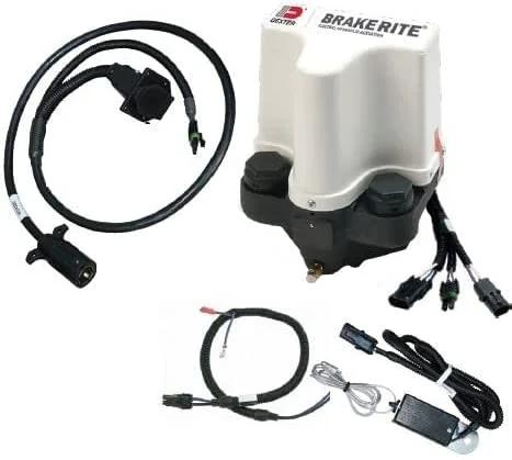 Front view of BrakeRite plug-n-play E/H actuator kit for disc brakes, white housing with black base and cables.
