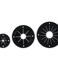 Three sizes of black rigging grommets with flexible rubber centers and sturdy plastic rings for marine rigging applications.