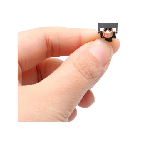 Ultra Lightweight Micro Electromagnetic Servo With Tight Four Mm Inner Bore And Zero Point Two Five Gram Weight held in hand for RC airplane.