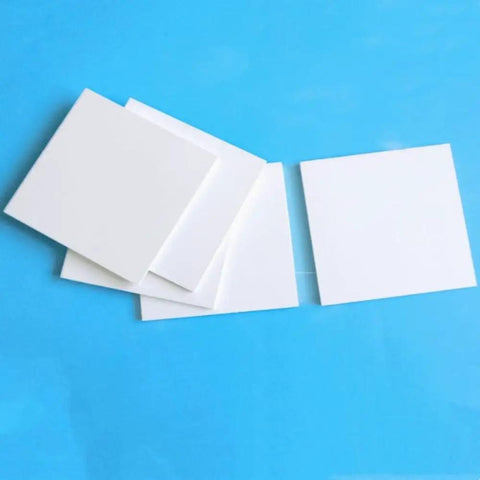 Boron Nitride Ceramic Sheet Pad And Plate For Heat Proof Performance, nonstick surfaces, 150 x 150 x 2 mm size shown on blue background