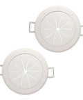 Pair of white 2-inch cable pass-through ports with spring-lock clamps, front view
