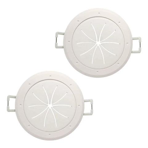 Pair of white 2-inch cable pass-through ports with spring-lock clamps, front view