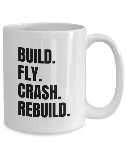 White ceramic Plane Lovers Coffee Mug Gift For RC Enthusiasts Remote Control Aircraft Hobby Present with 'Build Fly Crash Rebuild' text.