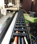 Open Type Drag Chain Cable Carrier With End Connectors 25x57mm Inner Size 1 Meter for CNC machines, installed view with cables.