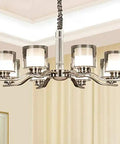 Slick Nickel Four Bulb Led Pendant Chandelier casts pure 5500k white light, featuring a sleek design with four glass shades.