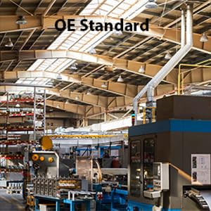 Manufacturing facility interior labeled OE Standard, showcasing industrial machinery and equipment.