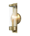 Castleton Antique Brass 1 Light ADA Wall Sconce With Clear Glass Cylinder, classic modern hallway bath lighting, side angle view