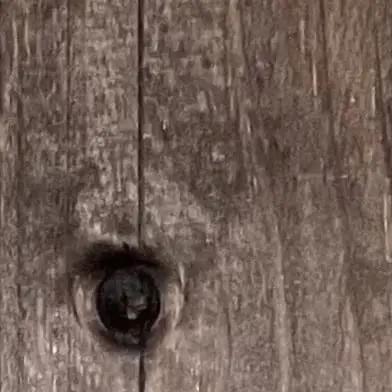Close-up of distressed wooden surface showing natural grain and knot, ideal for applying Lock In That Distressed Brandy Hue On Interior Wood Without Any Hiccups With This Butter Smooth One Coat Water Based Zero Vocs Wood Stain Eco Smart Low Smell Pick Perfect For Quick Barn Fixes And Garage Makeovers 5 Gallon.
