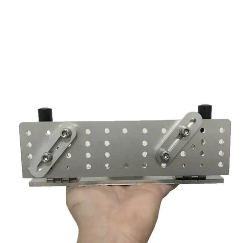 Hefty Aluminum Belt Sander Knife Jig Featuring Smooth Adjustable Angle Grinding Guide For Zero Friction Tool Sharpening and Rock Solid Clamping Stability That Really Kicks Your Daily Projects Into High Gear, showing adjustable metal base.