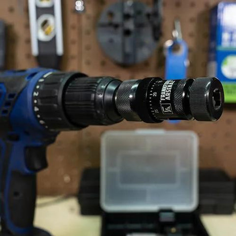Frankford Arsenal Universal precision case trimmer attached to a drill; knurled ring visible, storage case behind.