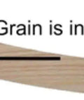 Close-up of steam bent solid red oak wood grain showing straight line pattern, illustrating quality for rocker runners.