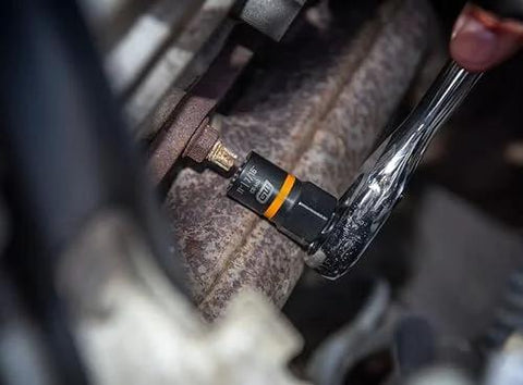 Close-up of a ratchet using the Seven Piece Metric Bolt Biter Extraction Socket Set With One Quarter And Three Eighths Inch Drive