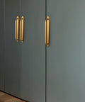 Antique Brass Zinc Alloy Cabinet Handle With Backplate 7.56 Inch Center To Center 192mm 2 Pack installed on gray cabinet doors
