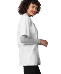Mens Short Sleeve Lab Coat White 31 Inch Consultation Jacket With Chest Pocket And Angled Pockets Unisex Medical Scrub Top For Docs And Nurses, side view with pockets.