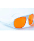 Premium Od5 Plus Laser Safety Glasses Featuring Snug Fit Frames Blocking Violet Blue And Green Beams From 266Nm Up To 540Nm CE EN207 Certified Work Ready Protective Goggles with orange tinted lenses.