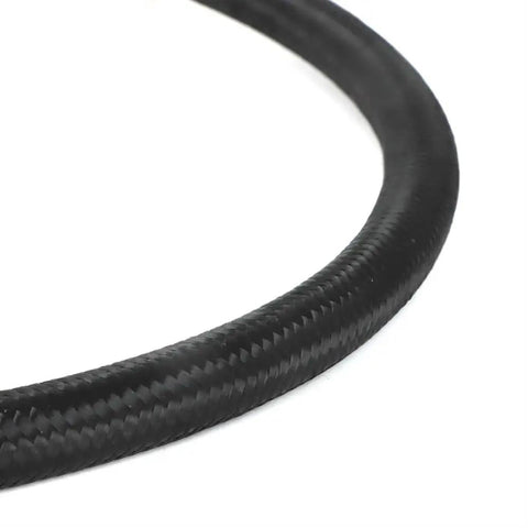 Black braided fuel hose from Hard Fuel Upgrade Kit For Trucks With 7.3 Idi And 6.9 Idi Diesel Engines To Boost Power And Efficiency By Routing Lines From Lift Pump Through Filter Directly To Injection Pump.