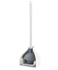 Heavy Duty White Toilet Plunger With Built In Storage Caddy sits in a sleek holder, showcasing its sturdy design for stubborn clogs.