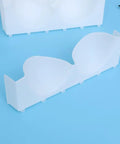 Six Piece Clear Plastic Bra Storage Box With Dividers For Wardrobe Closet Drawer Organization To Keep Lingerie Lineup Hella Neat And Shielded From Deformation A Straight Up Must Have Staple, featuring a single clear compartment for bra organization.