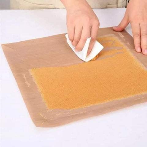 Hands using Five Pack Teflon Baking Sheets 12x16 Inch Nonstick Reusable Liners for kitchen tasks, displaying versatility and ease of use.