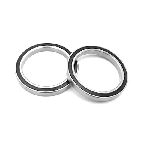 Get Your Hands on This Awesome 1 Pc 6713 ZZ Thin Section Deep Groove Ball Bearing Perfect For Tight Spots With Amazing Radial Load Capacity And Smooth Rollin Action For Any Cool Project Or Machine That Needs Serious Grit And Reliability. Silver ball bearing with black seal, showcasing a thin section design for tight spaces.