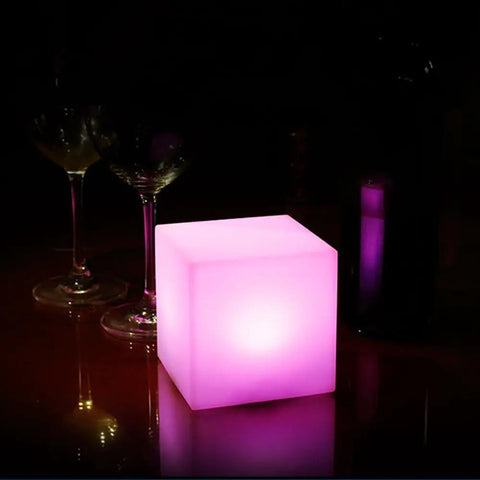 4 Inch Dimmable LED Night Light Mood Cube With 16 RGB Colors, illuminating pink on table with glassware, White Finish