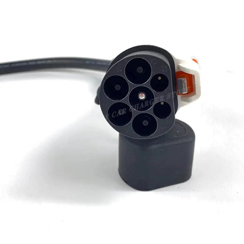 Badass 32A GBT To J1772 EVSE Adapter for electric vehicle charging with a robust design and multiple pin connections.